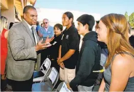  ?? U-T FILE ?? El Camino High School students take part in a 2019 ceremony for the opening of the Transition­al Youth Academy there. The academy, sponsored by Interfaith Community Ser vices, is a grant recipient of The San Diego Foundation.