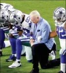  ?? The Associated Press ?? In this Sept. 25, 2017 file photo, the Dallas Cowboys, led by owner Jerry Jones, center, take a knee prior to the national anthem prior to an NFL football game against the Arizona Cardinals, in Glendale, Ariz. President Donald Trump's clash with the...