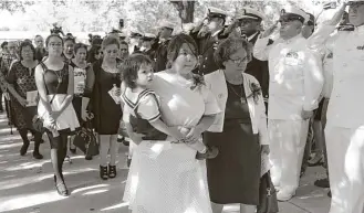  ?? Jerry Lara / San Antonio Express-News ?? Noe Hernandez’s family, including his wife, Dora, holding their 2-year-old son, Leon, and his mother, Virginia Yolanda Hernandez Lozano, arrive for his burial services.