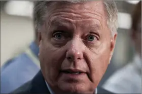  ?? J. SCOTT APPLEWHITE — THE ASSOCIATED PRESS ?? Senate Judiciary Committee Chairman Lindsey Graham, R-S.C., takes questions from reporters following a closed-door briefing on Iran, at the Capitol in Washington, Wednesday.