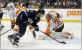  ?? TREVOR HAGAN — THE CANADIAN PRESS VIA AP ?? Winnipeg Jets’ Brandon Tanev (13) scores against Philadelph­ia Flyers’ goaltender Michal Neuvirth (30) after getting past Flyers’ Ivan Provorov (9) during second-period NHL hockey game action in Winnipeg, Manitoba, Sunday.