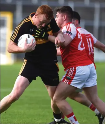  ??  ?? Dr Crokes’ Johnny Buckley challenged by Gareth Hickey Brosnan, Dingle in the Kerry County Garvey’s Supervalu Senior County Championsh­ip semi-final in Fitzgerald Stadium, Killarney on Sunday.
Photo by Michelle Cooper Galvin