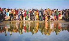  ?? PTI ?? Devotees arrive for taking holy dip at Sangam on Basant Panchami festival at the Kumbh Mela.