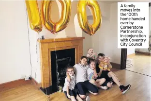  ??  ?? A family moves into the 100th home handed over by Cornerston­e Partnershi­p, in conjunctio­n with Coventry City Council