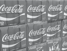  ?? KAREN BLEIER/AFP/GETTY IMAGES FILE PHOTO ?? Coca-Cola also said it was taking the unusual step of raising prices on its carbonated sodas in the middle of the year.