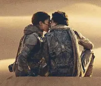  ?? (Photos courtesy of Warner Bros. Pictures) ?? Spooning in the dunes