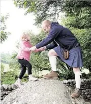  ??  ?? Right: Wow Scotland’s Gordon Pearson helps a child scale a boulder at Clava Cairns. Above: Mealt Falls on the Isle of Skye.