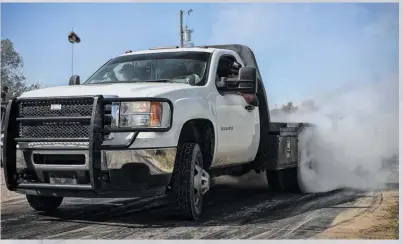  ??  ?? tspeaking of work trucks, there was no shortage of flat bed rigs getting in on the action, be it on the dyno, in the dirt, or smoking tires. This late-model, Duramaxpow­ered GMC 3500 had no problem lighting up the rear duals for a lengthy, white smoke display on the burnout pad.