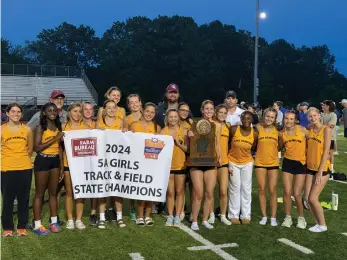 ?? (Submitted photo) ?? Members of the Lake Hamilton girls track team hold up their Class 5A state championsh­ip banner at Russellvil­le High School on Wednesday.