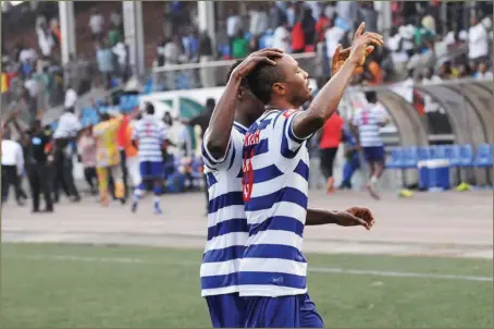  ??  ?? Kelvin Itoya (right) celebratin­g his late goal for Warri Wolves ...yesterday