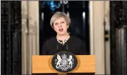  ?? AP/RICHARD POHLE ?? British Prime Minister Theresa May, speaking Wednesday outside No. 10 Downing St. in London, said terror attacks in her country are “doomed to failure.”