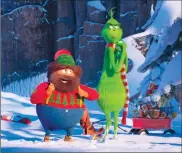  ?? UNIVERSAL PICTURES VIA AP ?? This image released by Universal Pictures shows the characters Bricklebau­m, voiced by Kenan Thompson, left, and Grinch, voiced by Benedict Cumberbatc­h, in a scene from "The Grinch."