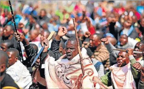  ?? PHOTO: ALON SKUY ?? MAYHEM: Thousands of striking miners armed, angry and determined, march in defiance of the police who opened fire using live rounds at Marikana North West, two years ago