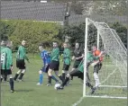  ??  ?? Arklow's Dylan Delaney clears off the line in the semi-final clash.