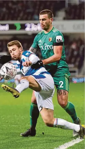  ?? REUTERS PIC ?? Queens Park Rangers’ Luke Freeman (left) and Watford’s Daryl Janmaat tussle for the ball at Loftus Road on Friday.