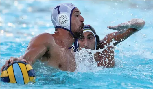  ?? ?? Neptunes' Stevie Camilleri (L) is challenged by Nicholas Bugelli (R) of San Giljan. Photos © Domenic Aquilina