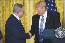  ?? AP PHOTO ?? President Donald Trump shakes hands with Israeli Prime Minister Benjamin Netanyahu during their joint news conference yesterday at the White House.