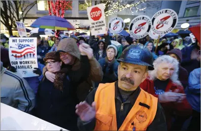  ?? ELAINE THOMPSON — THE ASSOCIATED PRESS ?? Boeing’s largest union, the Internatio­nal Associatio­n of Machinists and Aerospace Workers, is still smarting over a 2014deal that sacrificed pensions, locked in minimal raises and tied the hands of activists for a decade. Above, union workers rally in 2013in Seattle.