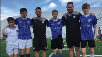  ??  ?? Stuart Hession, Leigh Whelan, Liam Doyle and Shane O’Neill with two of the SheffieldW­ednesday coaches during their stay in England.
