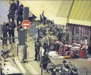  ?? AFP ?? The body of a victim covered by a white sheet lies outside a cafe in central Paris on Friday.