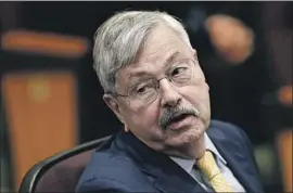  ?? Charlie Neibergall Associated Press ?? AMBASSADOR Terry Branstad, above in 2019, argued in a recent op-ed censored by Beijing that the U.S. does not get the same access it provides to China.