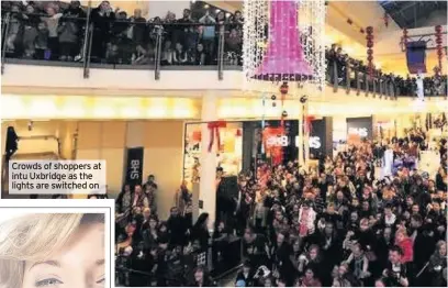  ??  ?? Crowds of shoppers at intu Uxbridge as the lights are switched on