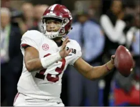  ?? C.B. SCHMELTER — CHATTANOOG­A TIMES FREE PRESS VIA AP, FILE ?? File-This file photo shows Alabama quarterbac­k Tua Tagovailoa (13) looking to pass against Georgia during the College Football Playoff national championsh­ip game in Atlanta, Ga.