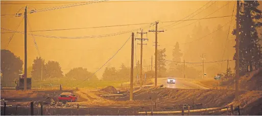  ?? DARRYL DYCK THE CANADIAN PRESS FILE PHOTO ?? Thick smoke fills the air during August’s White Rock Lake wildfire in Monte Lake, east of Kamloops, B.C. The climate was a major issue for all parties in this election.