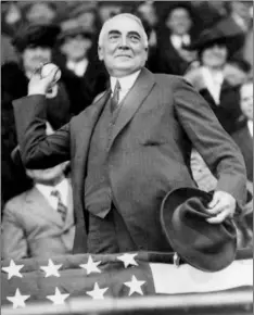  ?? AP Photo/FIle ?? In this 1921 file photo, President Warren G. Harding throws out the first ball to open the Washington Senators’ baseball season.