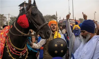  ?? Photograph: Danish Siddiqui/Reuters ?? A Nihang (Sikh warrior) at a protest against the newly passed farm bills, at the Singhu border near Delhi, India.