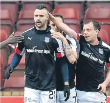  ??  ?? Marcus Haber (left) celebrates scoring against Motherwell.