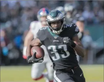  ?? JOHN BLAINE – DIGITAL FIRST MEDIA ?? Eagles running back Josh Adams runs for a first down against the Giants Sunday at Lincoln Financial Field. The Central Bucks South grad had a breakout game and played a big part in a 25-22 Eagles victory.