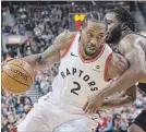 ?? CHRIS YOUNG THE CANADIAN PRESS ?? Toronto’s Kawhi Leonard, left, drives at Miami’s Justise Winslow in Toronto on Sunday. For complete coverage, visit our website.