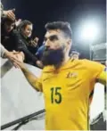  ?? — AFP ?? ADELAIDE: This file photo taken on June 8, 2016 shows Australian captain Mile Jedinak leaving the field after their World Cup football Asian qualifying match against Saudi Arabia at the Adelaide Oval in Adelaide.