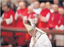  ?? ALESSANDRA TARANTINO/ASSOCIATED PRESS ?? Pope Francis celebrates Christmas Eve Mass last year in St. Peter’s Basilica at the Vatican. The pope said the Catholic Church might consider ordaining married men to serve as priests in remote areas.