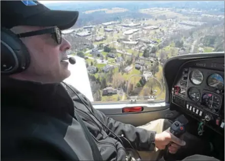  ?? PETE BANNAN – DIGITAL FIRST MEDIA ?? Brandywine Flight School owner Stephen Richards flies high over Chester County.