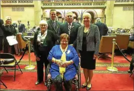  ?? PHOTO PROVIDED ?? Carol Hotaling, seated, was recognized by the state Assembly recently for her efforts in getting Yellow Ribbon Day establishe­d in New York State. She is joined, left to right, by close friend Beverly Czub, Clifton Park Supervisor Phil Barrett,...