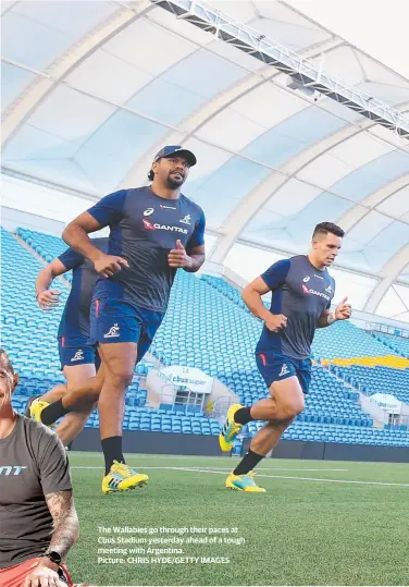  ?? Picture: CHRIS HYDE/GETTY IMAGES ?? The Wallabies go through their paces at Cbus Stadium yesterday ahead of a tough meeting with Argentina.