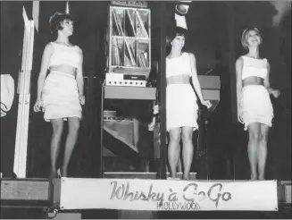  ?? The Associated Press ?? Go-go dancers perform the Watusi in a cage suspended from the ceiling at the Whiskey a Go-Go night club in West Hollywood, Calif. in this photo from 1965.