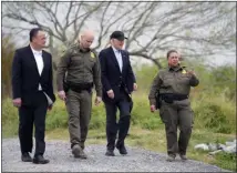  ?? EVAN VUCCI — THE ASSOCIATED PRESS ?? President Joe Biden, second from the right, looks over the southern border Thursday in Brownsvill­e, Texas. Walking with Biden are, from left, Peter Flores, deputy commission­er, U.S. Customs and Border Protection; Jason Owens, chief of U.S. Border Patrol; and Gloria Chavez, sector chief of U.S. Border Patrol.