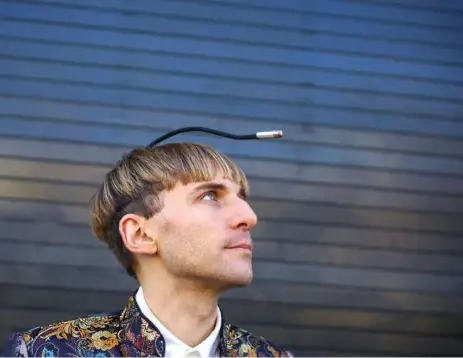  ?? LARS NORGAARD ?? Neil Harbisson, 34, lives with an antenna fixed to his skull. The pre-eminent “cyborg” uses the device to interpret sounds from colours.