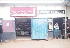  ?? ?? David Vusi Dlamini (58) in an intervew with Times Journalist Yussuf Mohammed over the weekend. (R) The shop, situated at Mhobodleni Zone 4 area in Manzini is yet to be removed from its location.