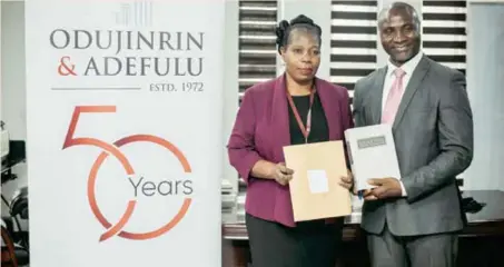  ?? ?? Odujinrin & Adefulu donate over 1000 law books and funds to the Faculty of Law Library, University of Lagos. The donation which took place on Wednesday, 8th December 2021, starts the celebratio­n of the firm’s journey to its 50th Anniversar­y. L-R: Yetunde Zaid, university librarian, University of Lagos; and Lucky Ayeki, partner, Odujinrin and Adefulu.