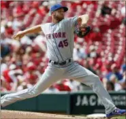  ?? JOHN MINCHILLO — THE ASSOCIATED PRESS ?? Mets starting pitcher Zack Wheeler throws in the first inning of a game against Reds, Wednesday in Cincinnati.