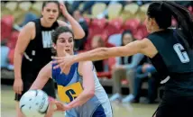  ??  ?? Massey captain Laura Lobb, centre, looks to pass while under scrutiny from her Manukura Black opposite Sheridan Bignall in the premier club final.