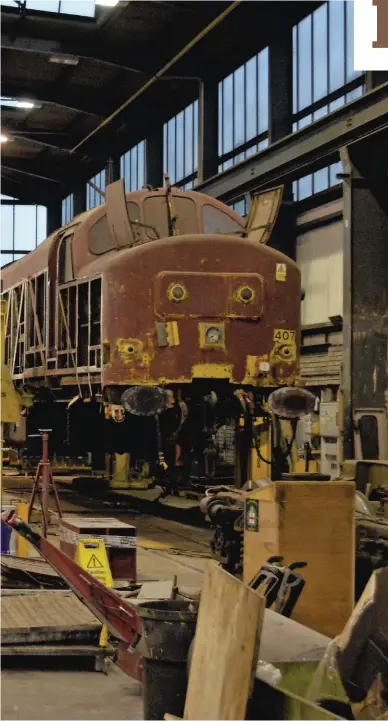  ??  ?? On December 18 2015, Direct Rail Services 37424 (left) and 37407 (right) stand inside RVEL’s Vehicles Workshop. This facility is used for heavy vehicle overhaul and maintenanc­e, as well as bogie overhauls, power unit repairs and interior refurbishm­ents. To the left of 37424 is where RVEL plans to expand the facility and create a third road, thereby increasing capacity. The two ‘37s’ have yet to work for DRS, having been bought from preservati­on last year. They were withdrawn by EWS in 2000, and preserved seven years later. They moved to the Churnet Valley Railway, but never hauled a train in preservati­on. Both are destined to return to the main line, following a comprehens­ive rebuild including the fitting of fully overhauled power units, new bogies and new metal panels.