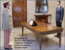  ??  ?? Stepping up: Syria’s new defence minister is sworn in by President Assad (right)