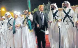  ?? REUTERS ?? On his first foreign tour as the US president, Donald Trump joined in a traditiona­l sword dance welcome ceremony ahead of a banquet at the Murabba Palace in Saudi Arabia. Video of the event shows Trump, surrounded by Saudi officials, bopping back and...