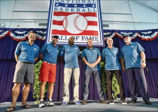  ?? HYOSUB SHIN / HSHIN@AJC.COM ?? New Hall of Famers (from left) Trevor Hoffman, Chipper Jones, Vladimir Guerrero, Jim Thome, Alan Trammell and Jack Morris pose for a group photograph before a news conference at the Clark Sports Center on Saturday in Cooperstow­n, N.Y. They will be...