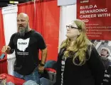  ?? ?? Phil Smith and Brittney Cline said they are looking to hire new employees at Mechanical Services & Design. They operated a booth at the Summer Job Fair held at the Wright State on, Wednesday.